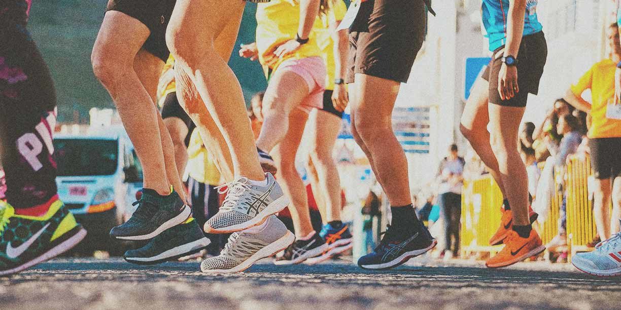 group of runners at the start line of a 5k race