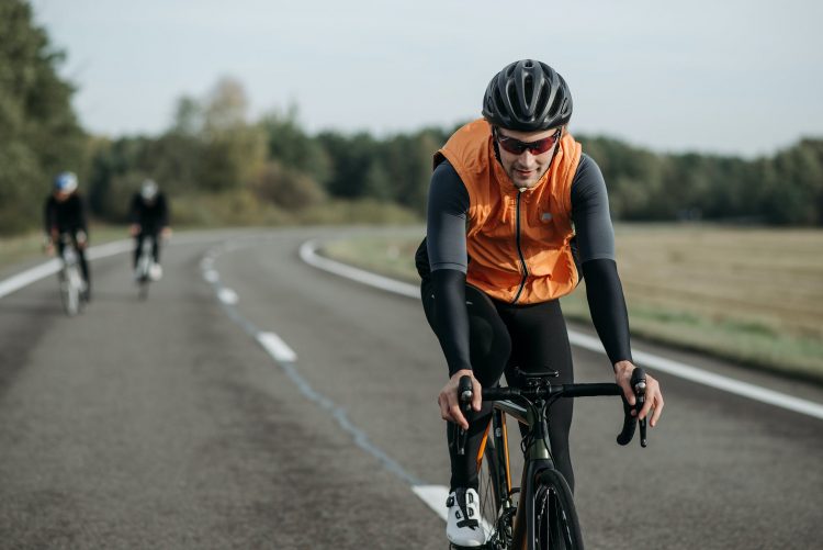 cyclists riding on road