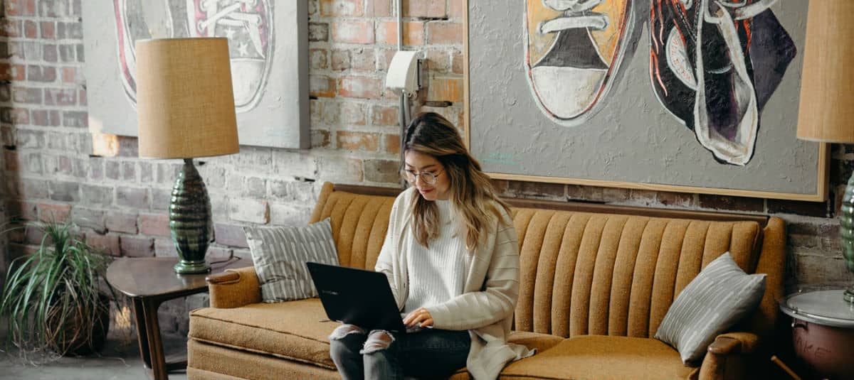 girl planning fundraiser on couch