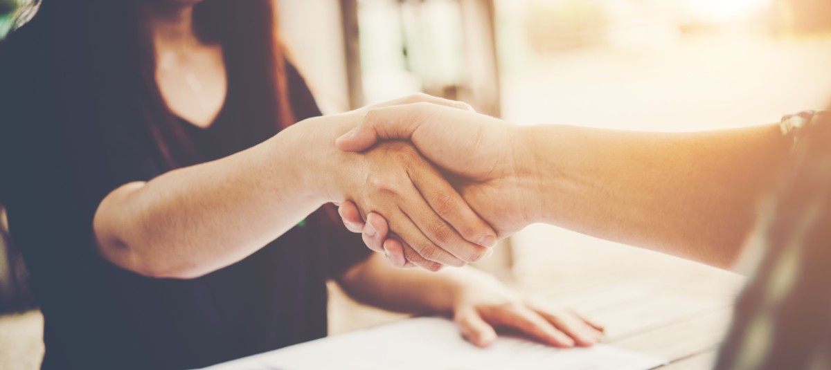 man and woman shaking hands