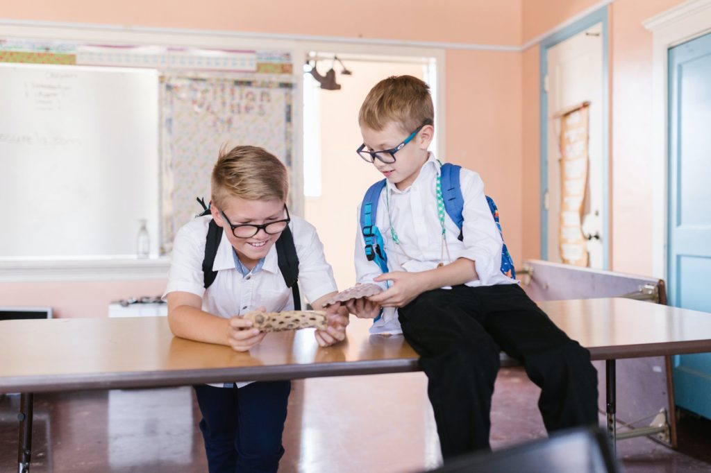 kids at school looking at toys