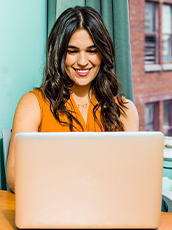 woman typing on laptop