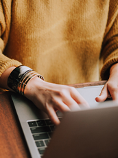 woman typing on laptop