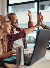 three people giving high five