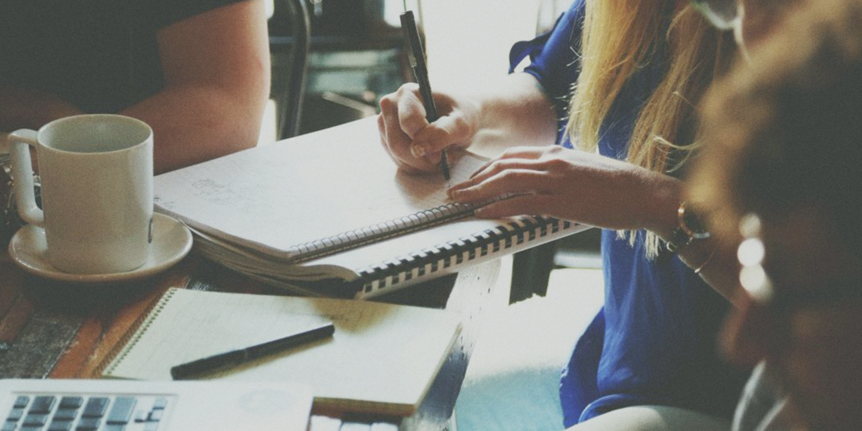 Person writing in a notebook