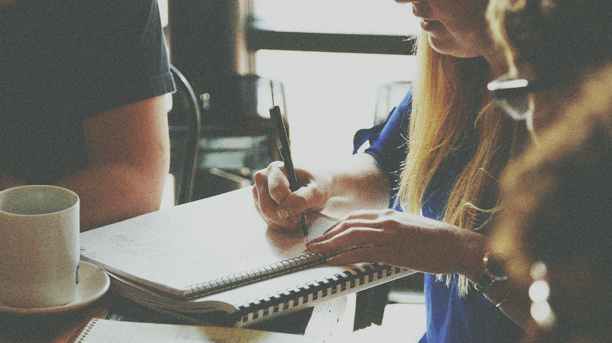 woman taking notes