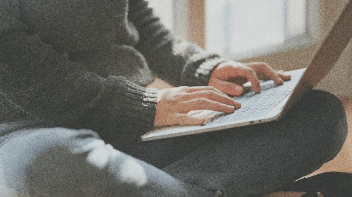 person typing on a laptop